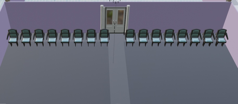 Image description: A single row of chairs in an under construction auditorium. A middle aisle in front of the back door splits the row in half.