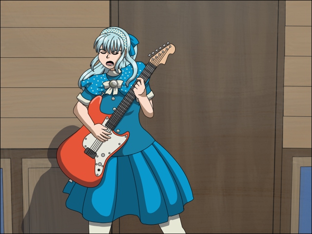 Image Description: Piper is playing an electric guitar while she dramatically poses and sings the start of a ballad. She is standing in front of a wall with a wood door and wood panels.